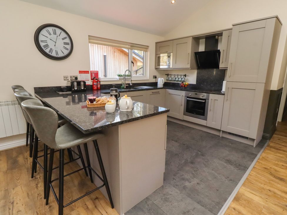 A kitchen with a sink and appliances at Barn Owl in Otterburn