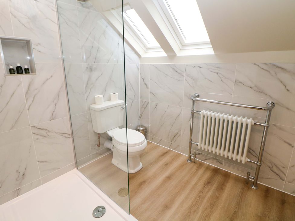 A bathroom featuring a toilet and shower at Brookhouse in Castleton, Peak District