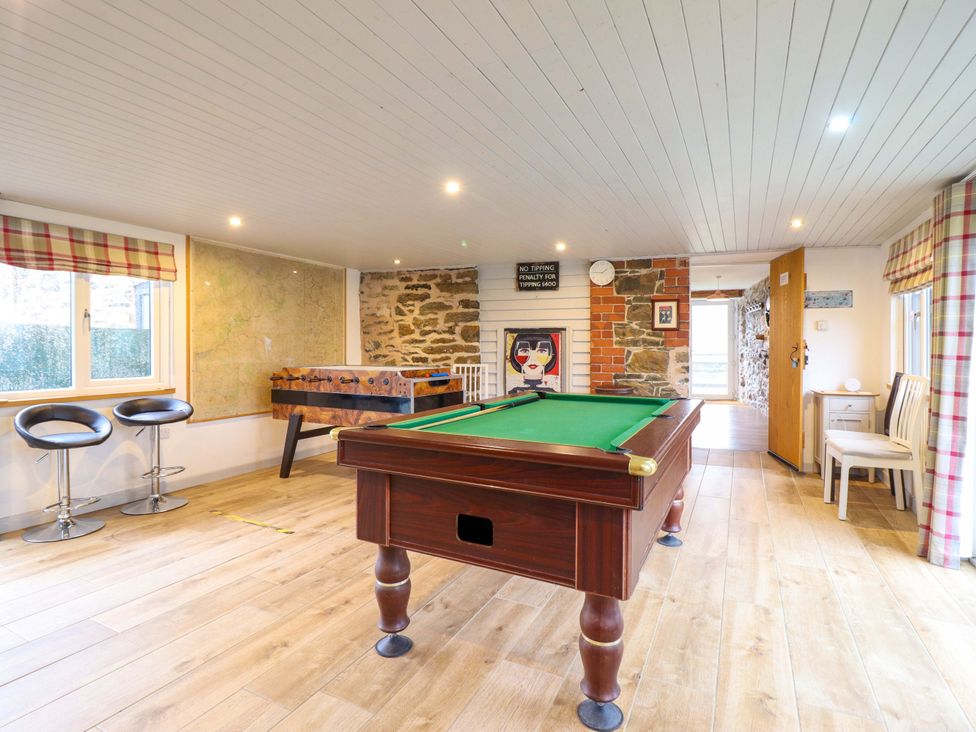 A games room with a pool table and foosball table at Bwthyn Y Bugail (Shepherd's Cottage) Pedairffordd near Llanrhaeadr-Ym-Mochnant