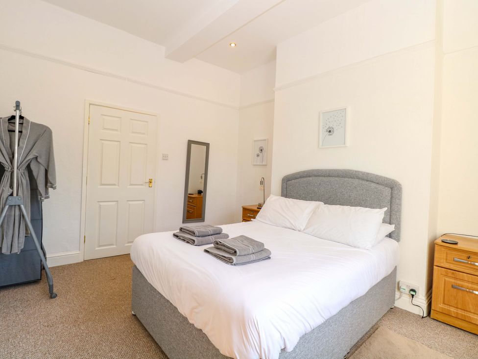 A bedroom with a bed and towels on it at Sunnymeade in Buxton, Norfolk