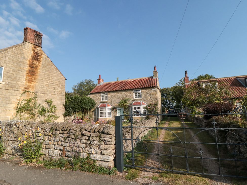 A house with a garden and gate at Bute Cottage Lockton near Pickering