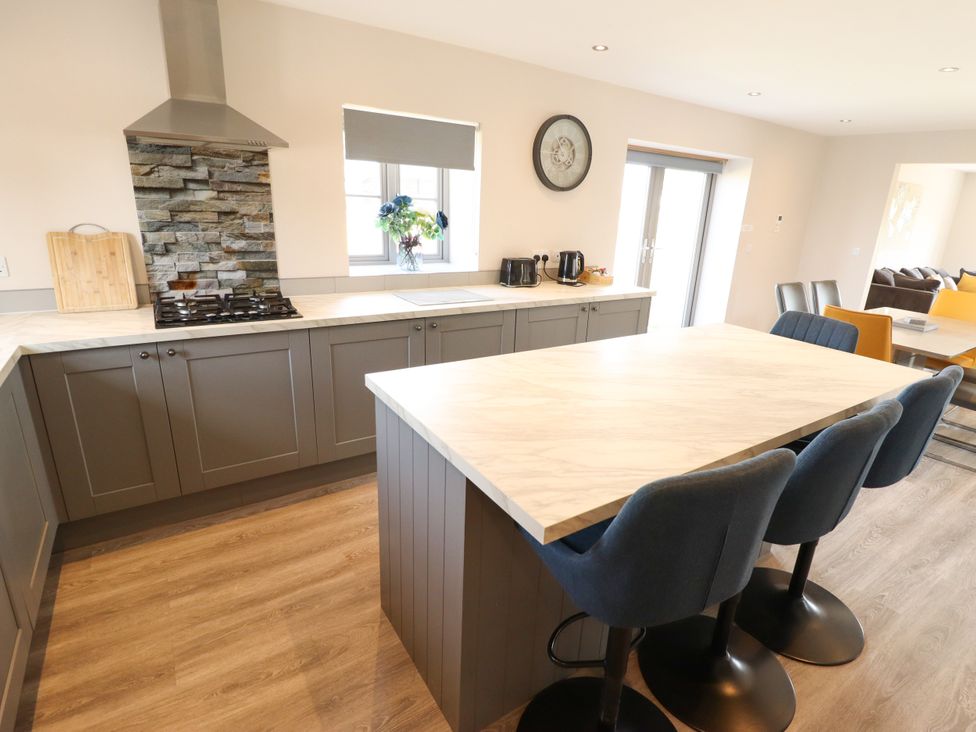 A kitchen with cabinets and a countertop at Acacia Barn in Wrangle near Friskney