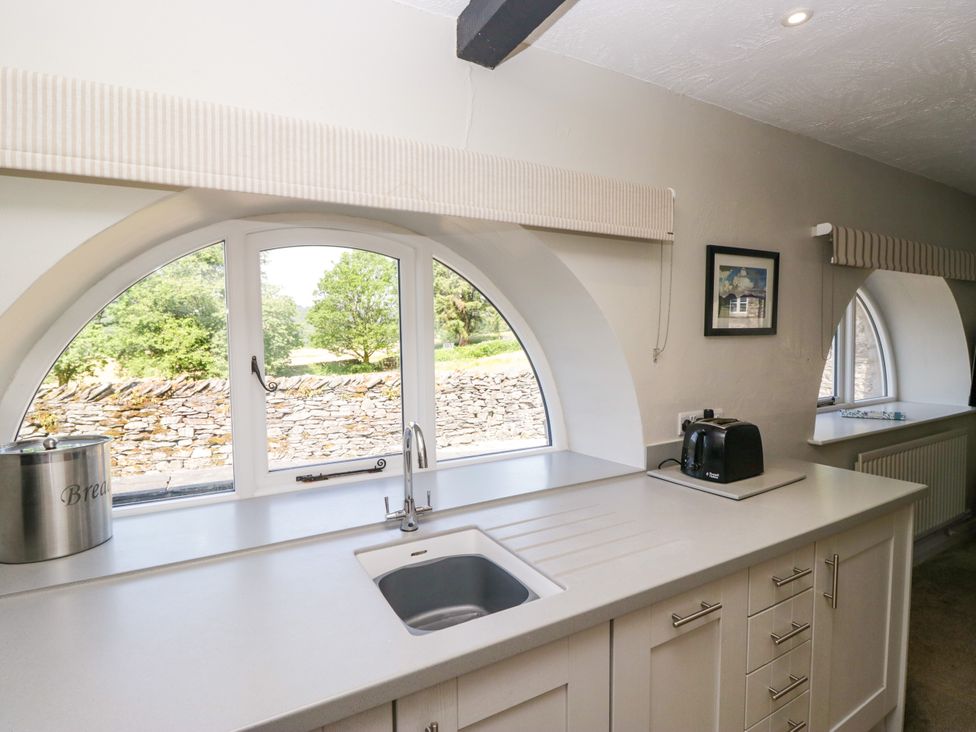 A kitchen with a sink and toaster at Windermere at the Graythwaite Estate near Hawkshead