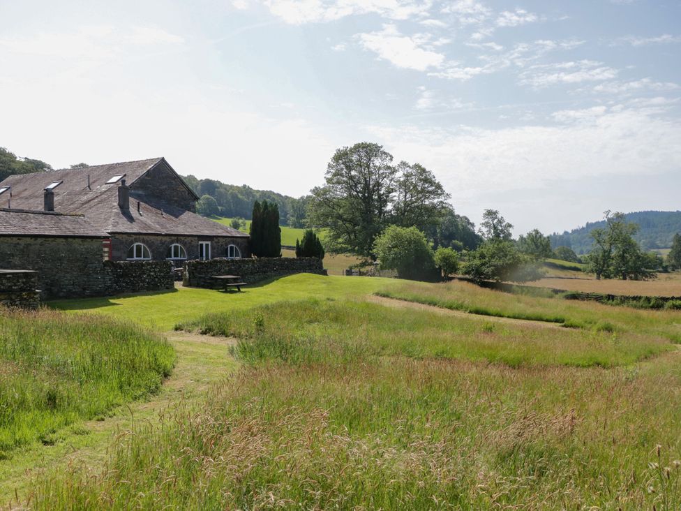 A building next to grassy fields at Windermere at the Graythwaite Estate Graythwaite Estate near Hawkshead