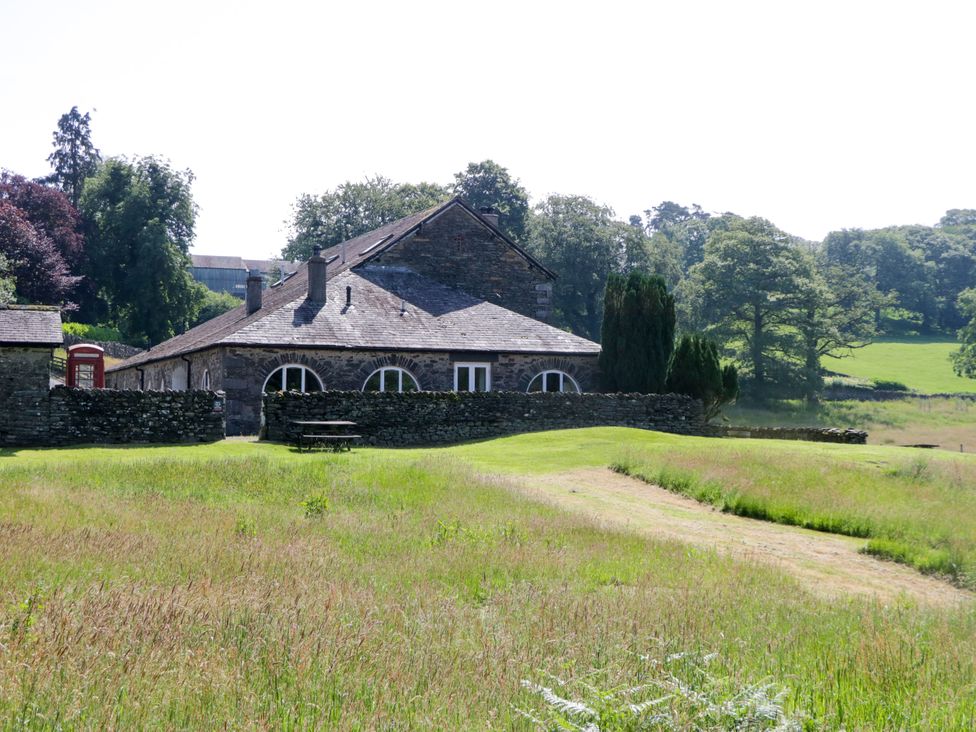 A house with a telephone box and table in a field at Windermere at the Graythwaite Estate near Hawkshead