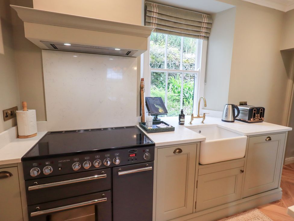 A kitchen with a stove and sink at High Torver House in Torver