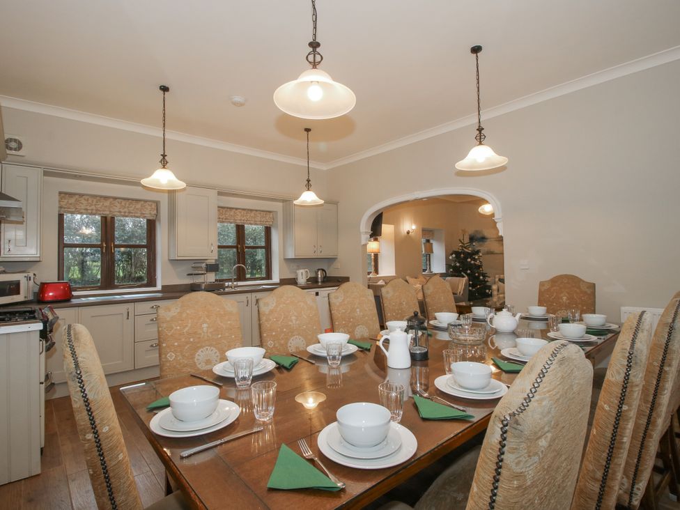 A kitchen with a dining table set for a meal at The Park in Ludlow