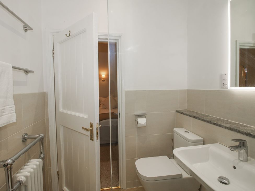 A bathroom with a toilet and sink at The Park in Ludlow