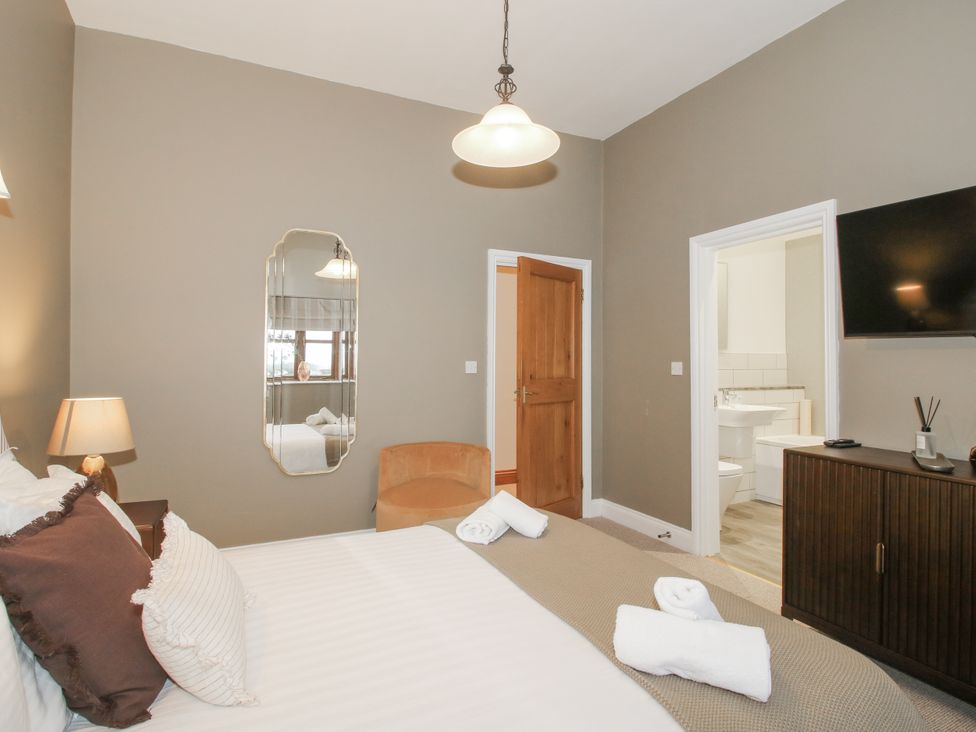 A bedroom with a bed and a television at The Park in Ludlow