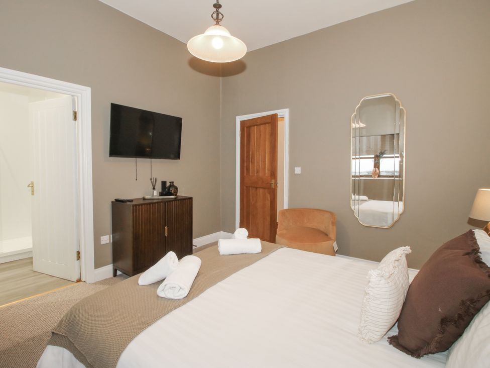 A bedroom with a bed and a television at The Park in Ludlow