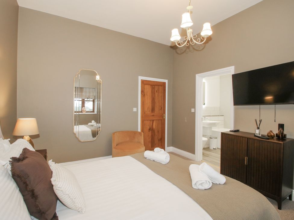 A bedroom with a bed and television at The Park in Ludlow