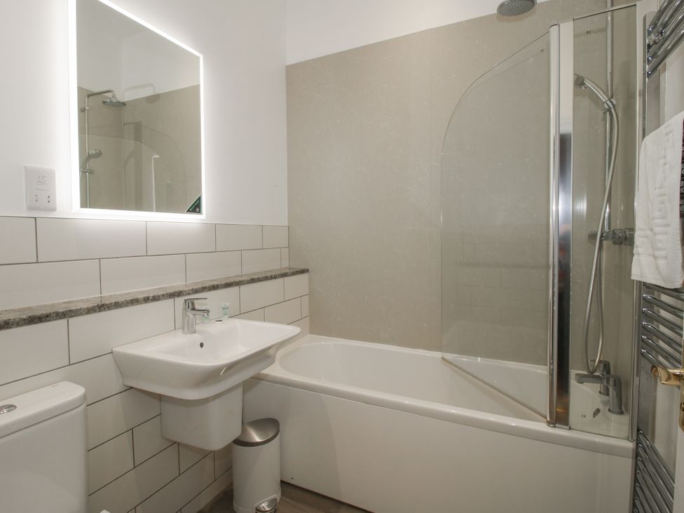 A bathroom with a bathtub, sink, and shower at The Park in Ludlow