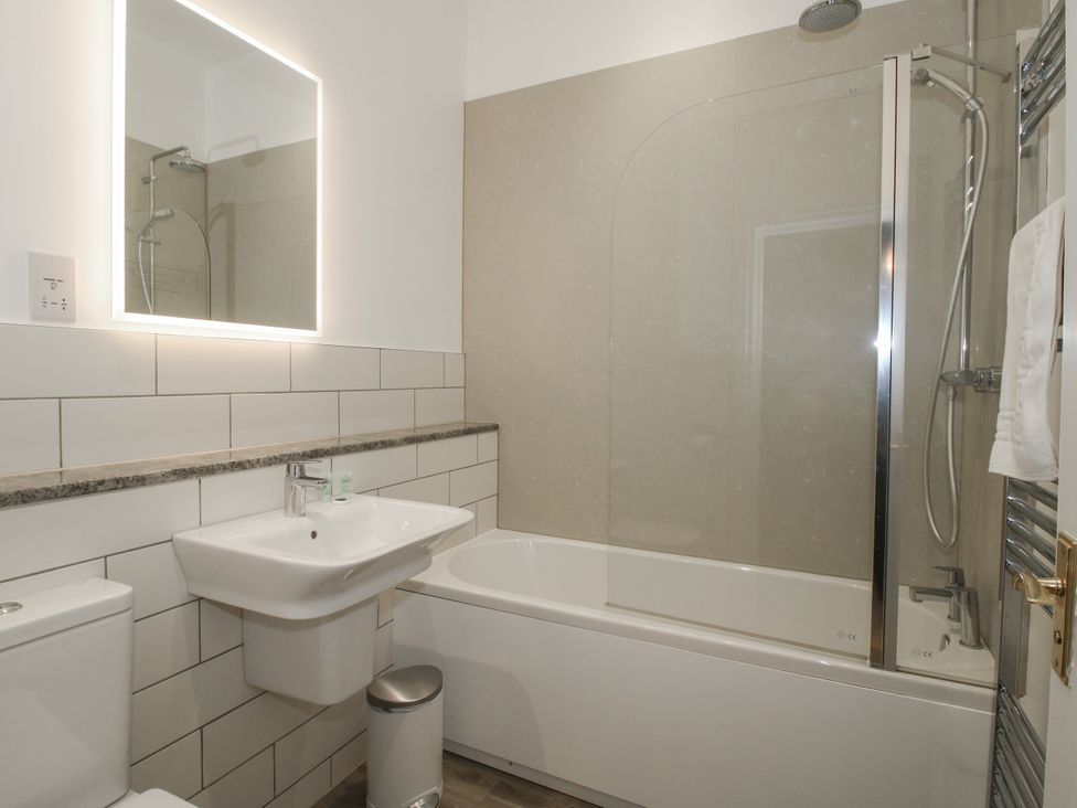 A bathroom with a bathtub, sink, and shower at The Park in Ludlow