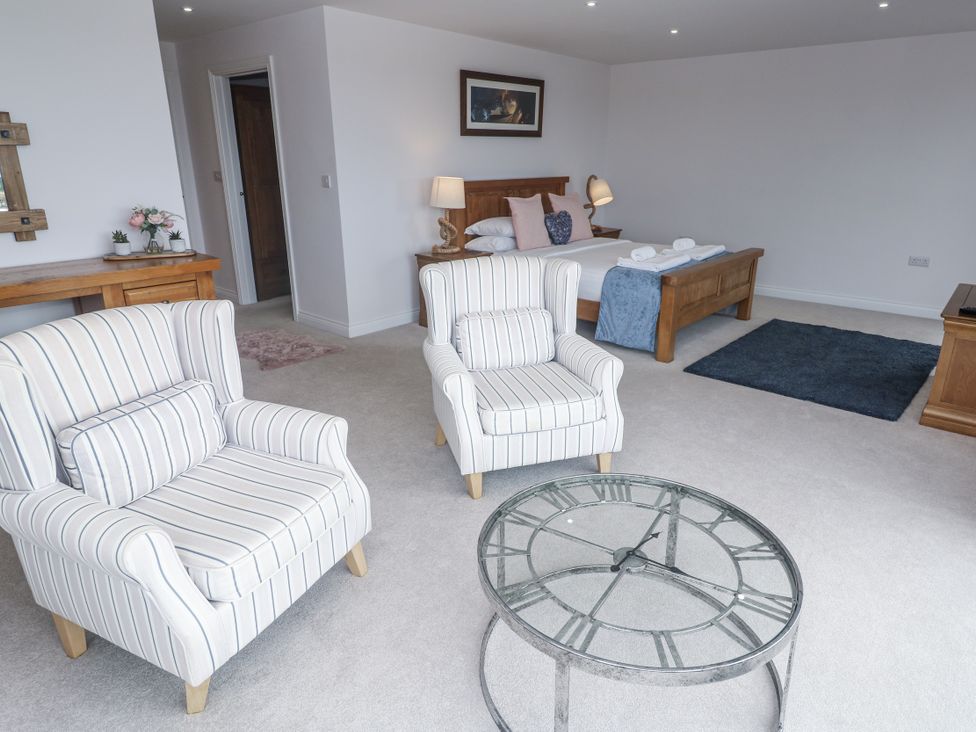 A living room with chairs and a coffee table at Atlantic View in Germoe