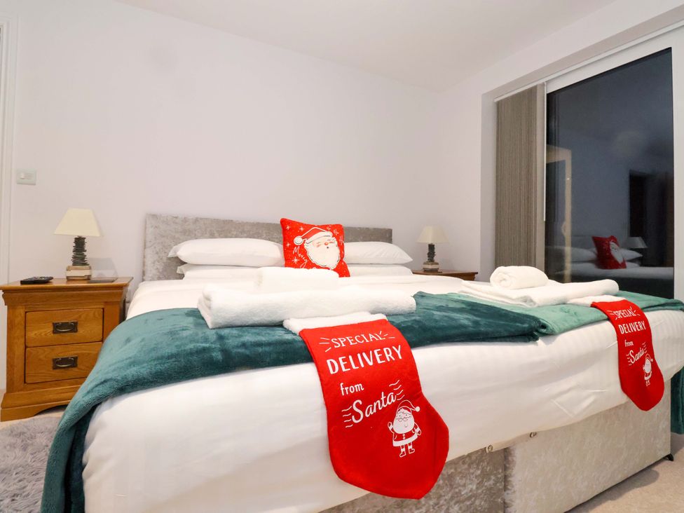 A bedroom with a bed and bedside table at Atlantic View in Germoe