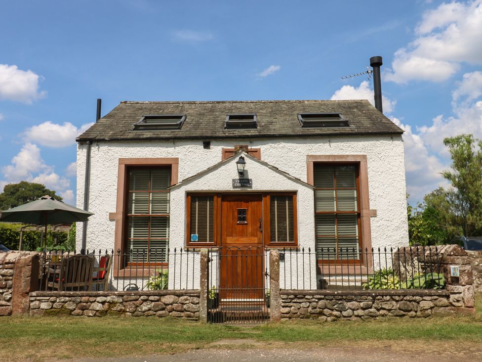 A cottage with a front door and windows at Chapel Cottage Sandford, Cumbria