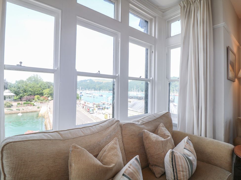 A living room with a view of the harbor at 2 York House in Dartmouth