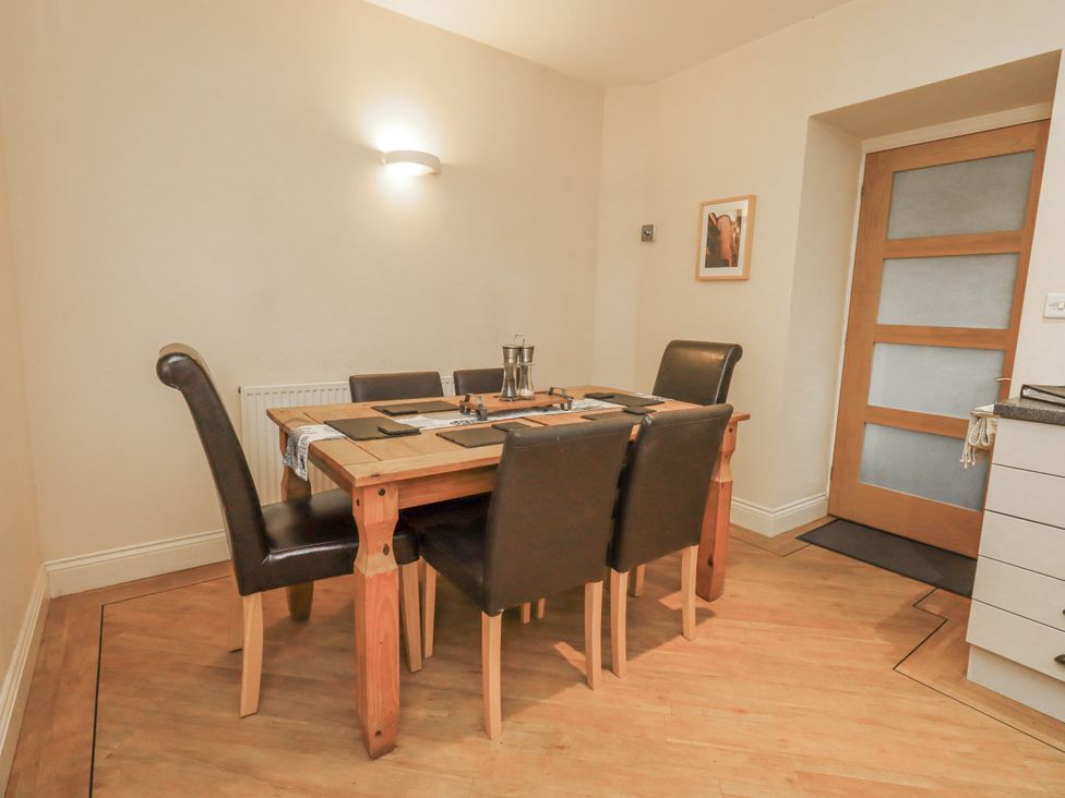 A dining room with a table and chairs at Old Bridge Inn Ingleton