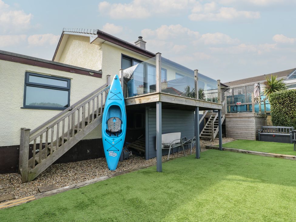 An outdoor area with stairs and a kayak at Daisy Cottage in Benllech