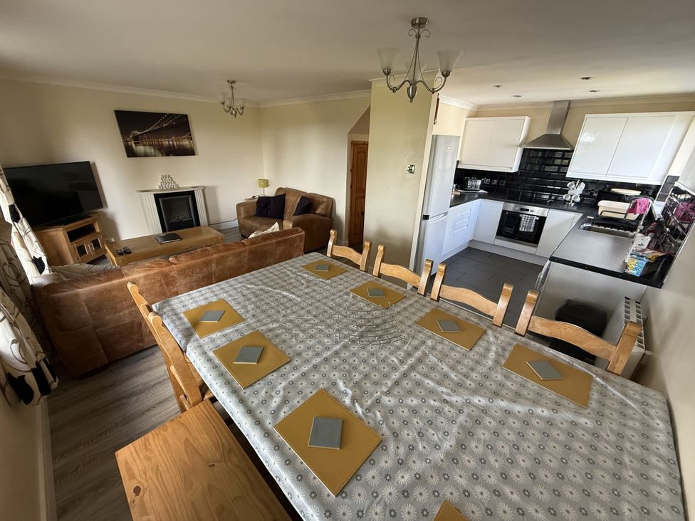 A dining room with a table and chairs in Hembry Meadows Honicombe Park near Gunnislake