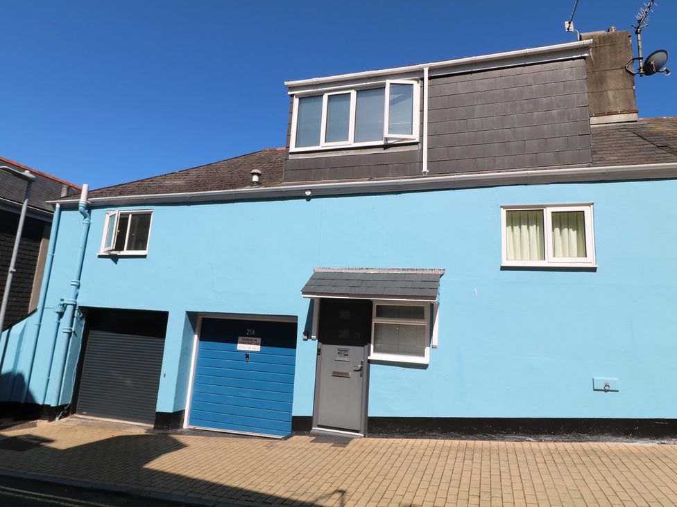 A house with blue exterior and garage door at 21 Above Town in Dartmouth