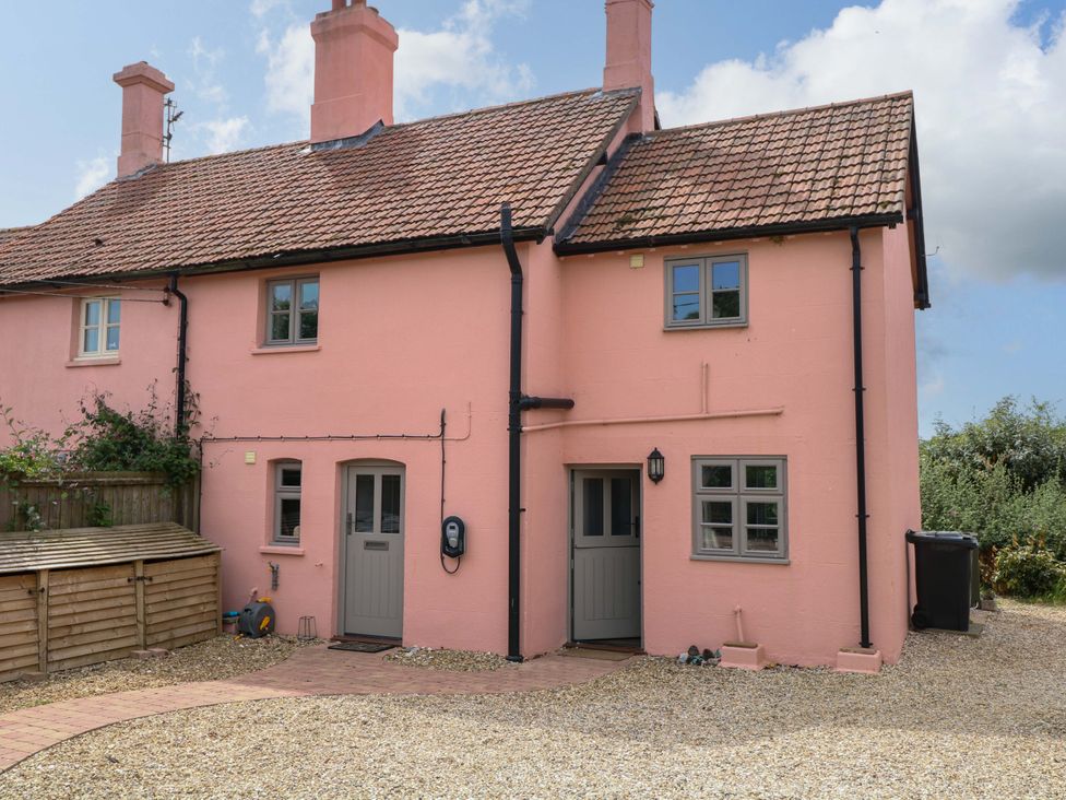 A house with a front door and windows at The Mallows in Walsingham