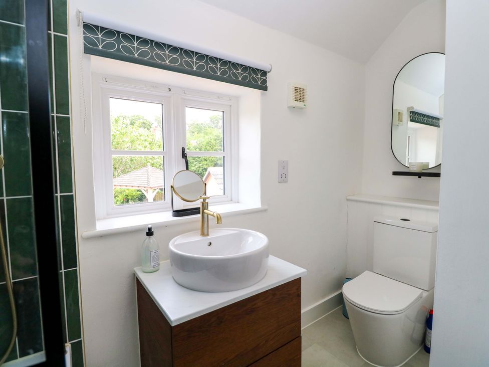 A bathroom with a sink and toilet at The Mallows in Walsingham