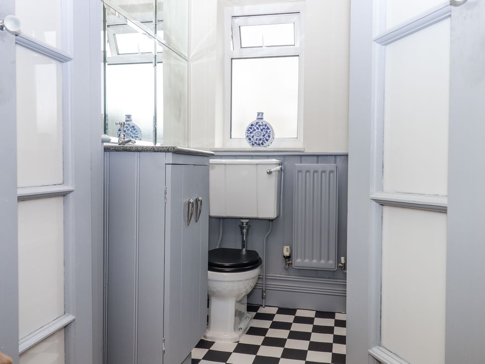 A bathroom with a toilet and sink at Lion House in Moretonhampstead