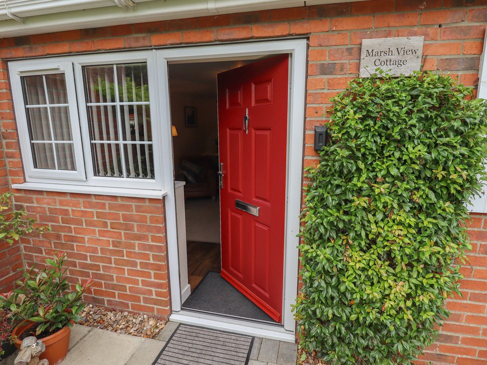 An entrance with a red door at Marsh View Cottage Wainfleet All Saints
