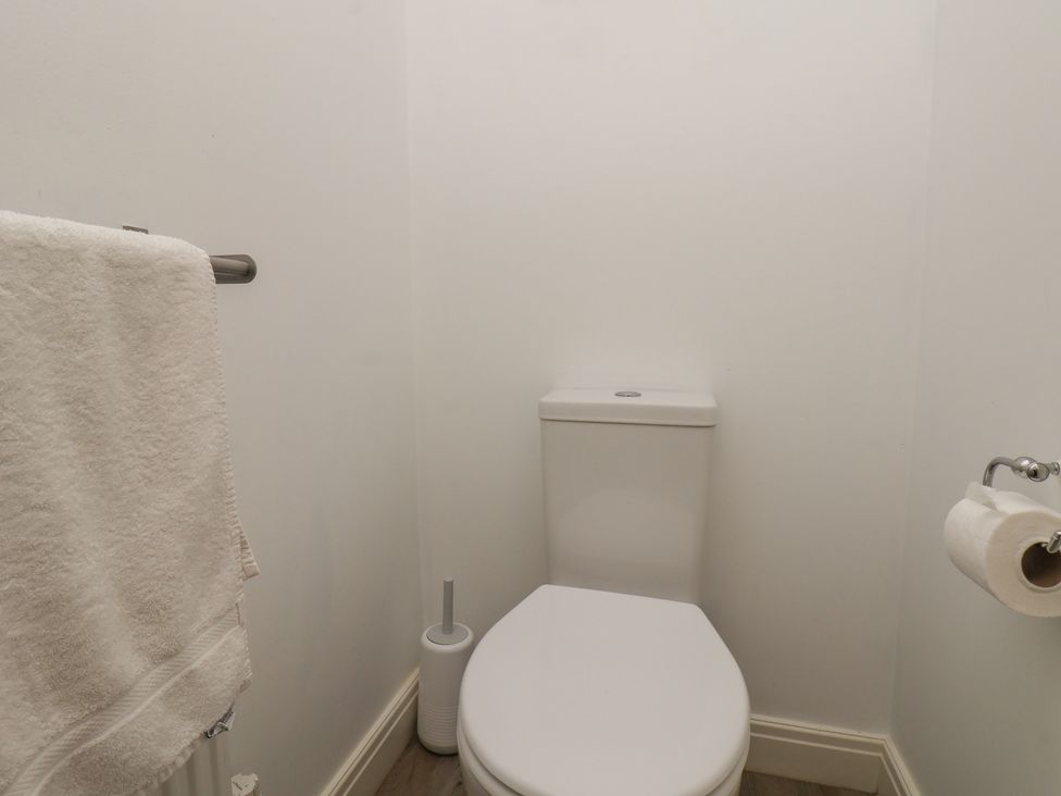 A bathroom with a toilet and towel rail at Buck Place The Bay - Filey