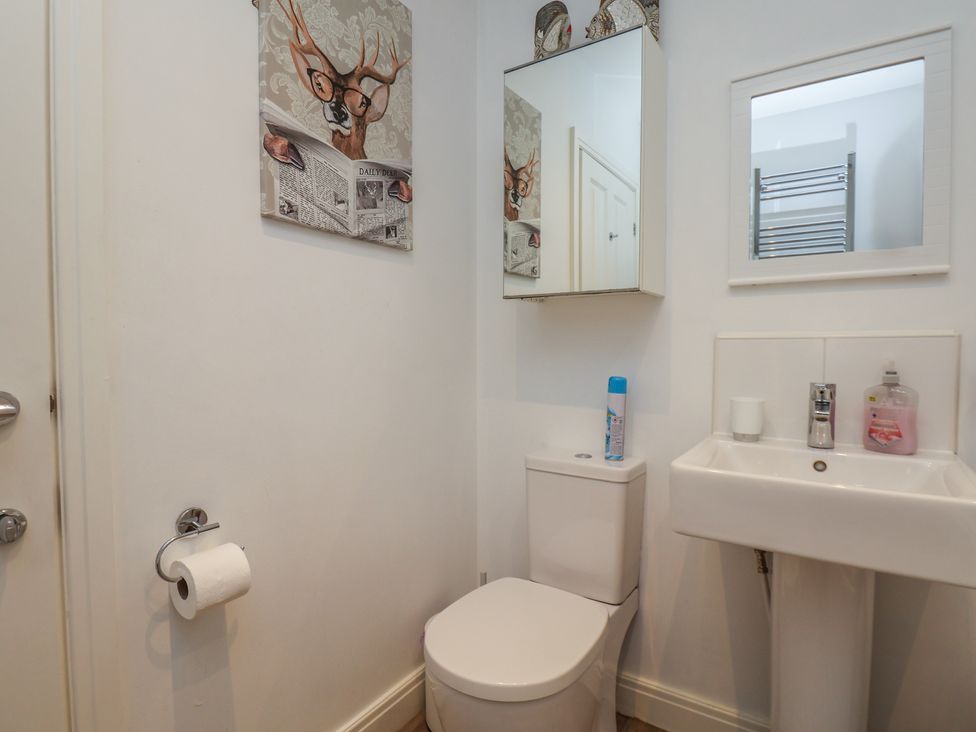 A bathroom with a toilet and sink at Buck Place The Bay - Filey