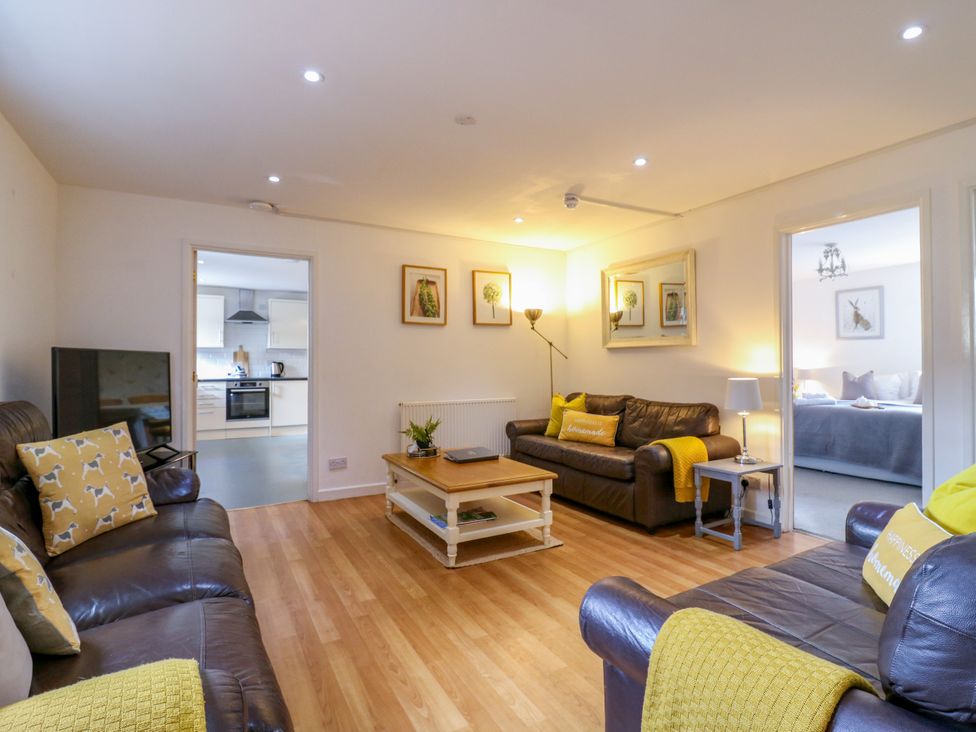 A living room with a sofa and a coffee table at BB House Roxhill Manor Farm