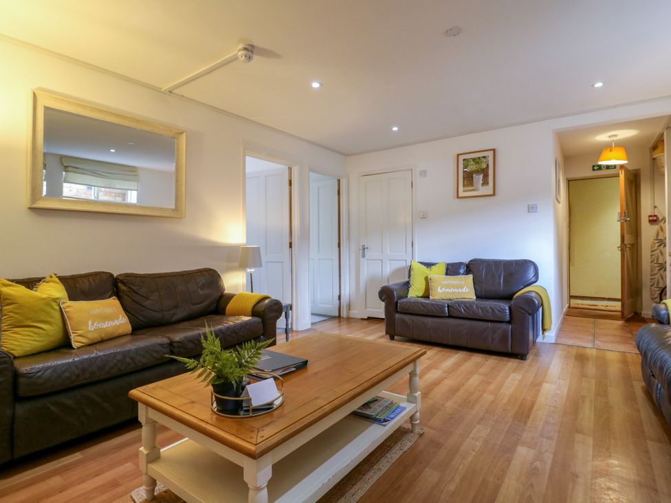 A living room with sofas and a coffee table at BB House Roxhill Manor Farm