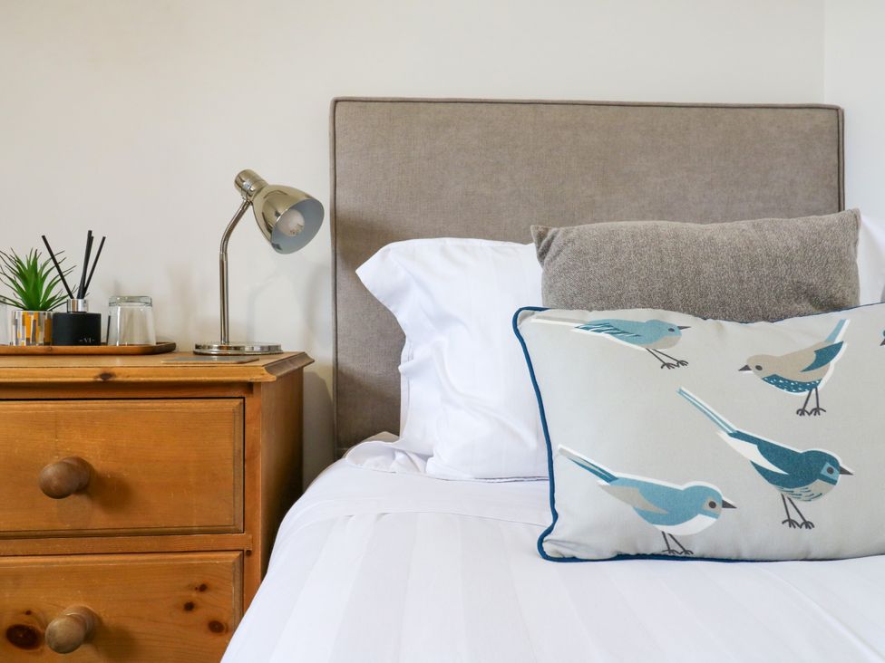 A bedroom with a bed and nightstand at BB House Roxhill Manor Farm