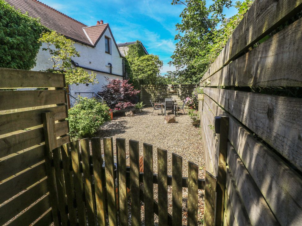 A garden area with gravel and seating at Stable Cottage, Templeton near Narberth