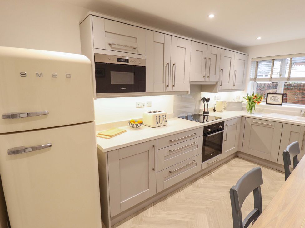 A kitchen with appliances and countertop at Armstrong Cottage Beverley