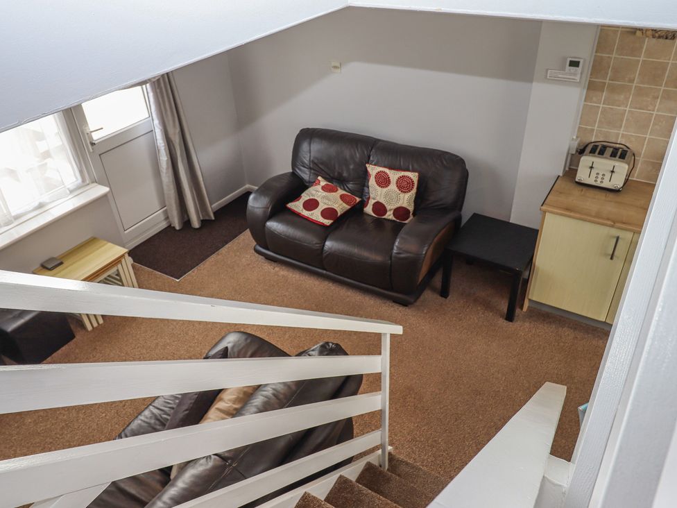 A living room with a sofa and coffee table at Turtle Chalet in Dawlish Warren