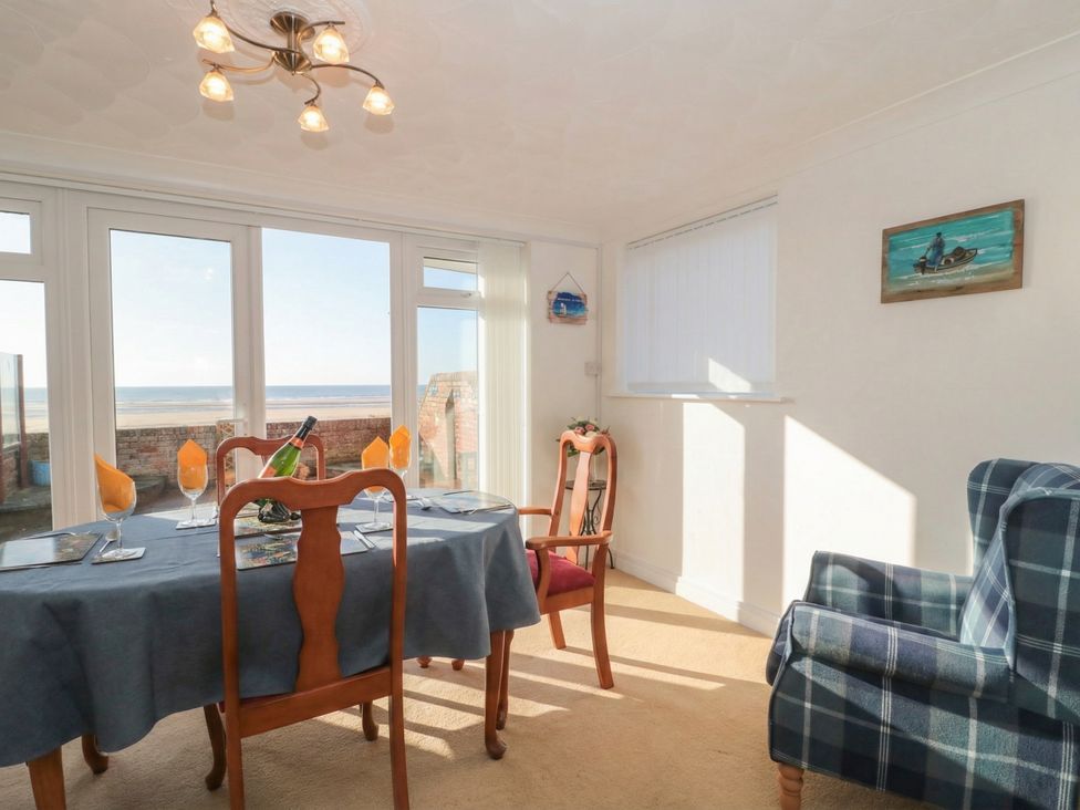 A dining room with a view at Breaking Waves in Burnham-On-Sea