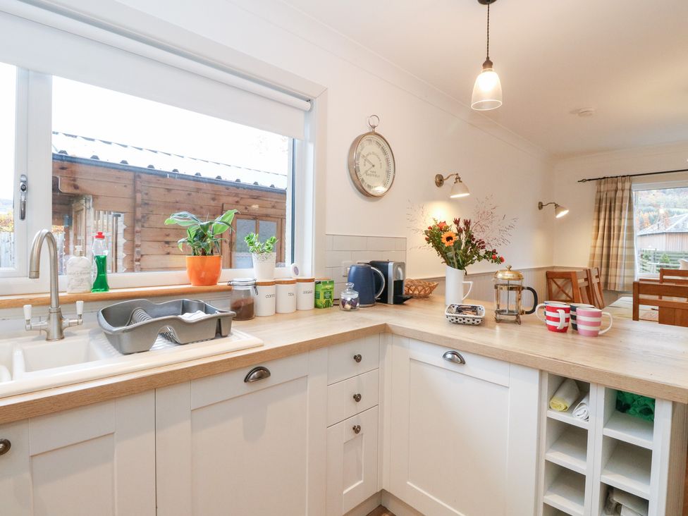 A kitchen with a sink and countertop at Beechwood Cottage in Blair Atholl