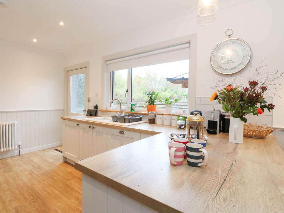 A kitchen with a sink and countertop at Beechwood Cottage in Blair Atholl