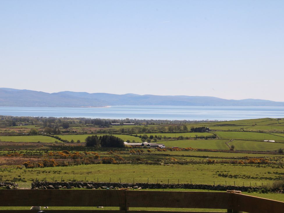 A view of fields and mountains by the sea at Ty Coch, Llanaelhaearn near Trefor, Caernarfon