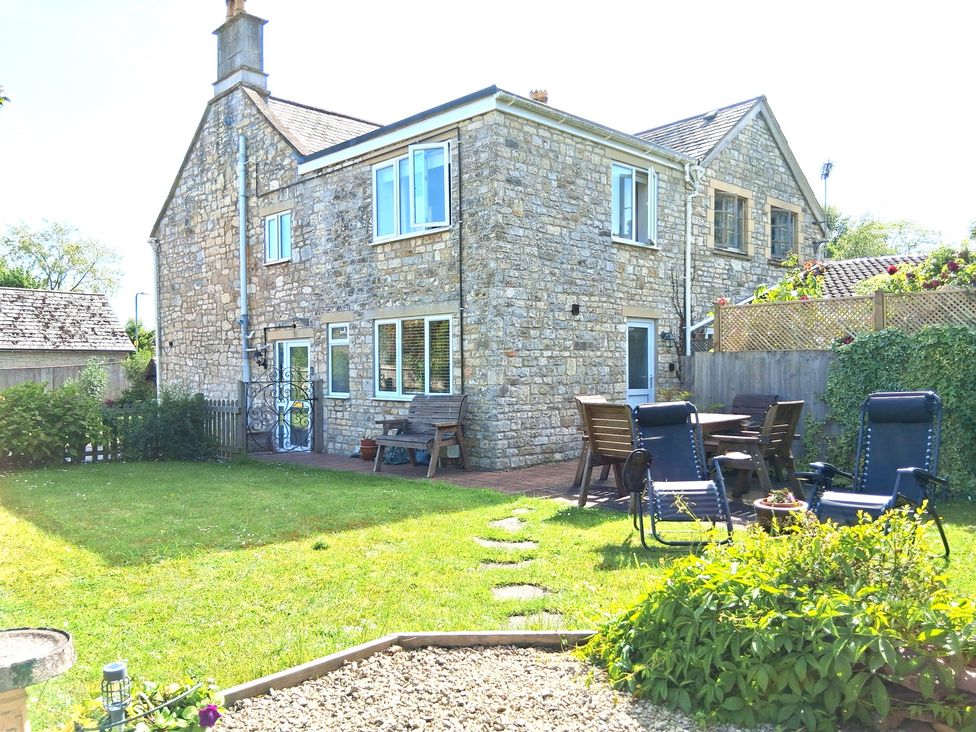 A stone house with garden furniture at Crooked Well Timsbury, Nr Bath