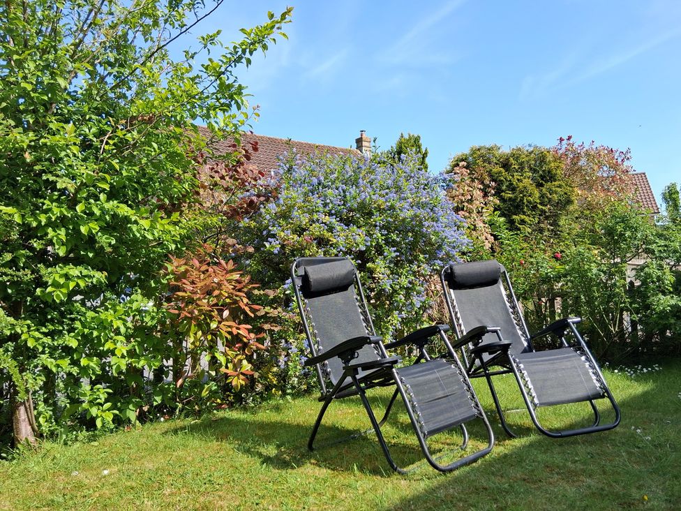Two deck chairs in a garden at Crooked Well Timsbury, Nr Bath
