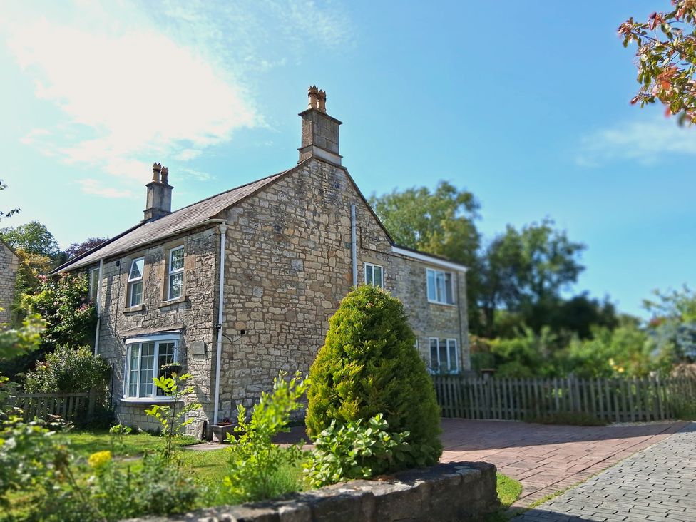 A house with a garden and pathway at Crooked Well in Timsbury, Nr Bath