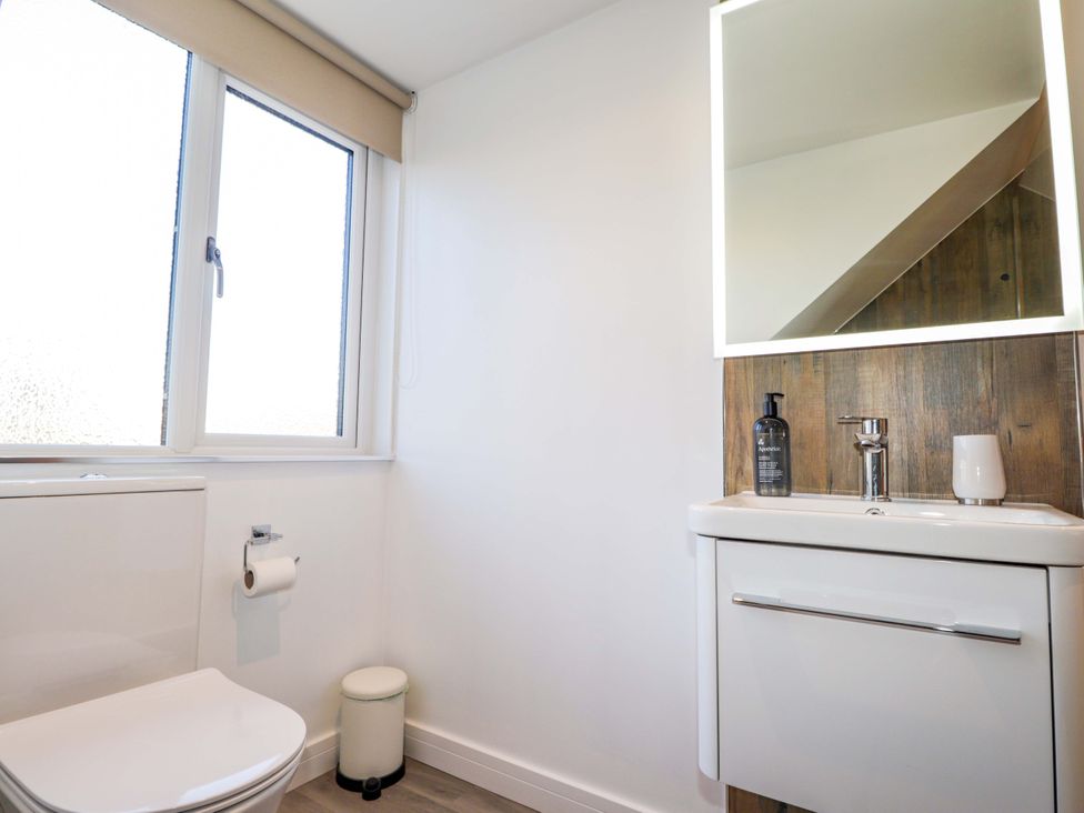 A bathroom with a sink and toilet at 3 Croftside in Aviemore