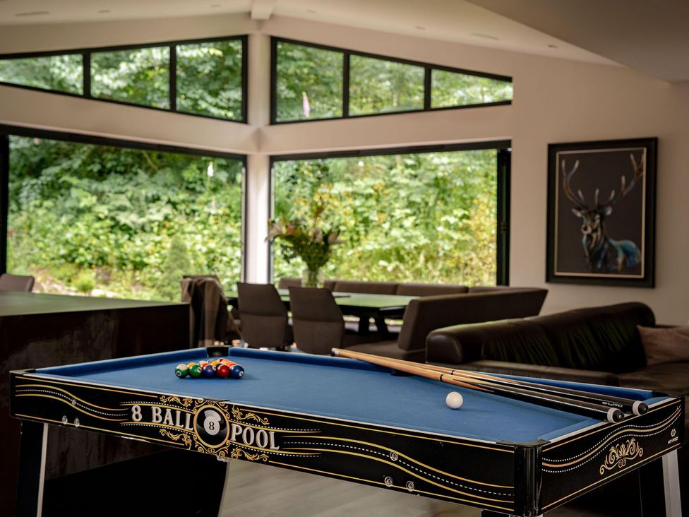 A game room with a pool table and seating at Heilan Roo Killiecrankie near Pitlochry and Blair Atholl