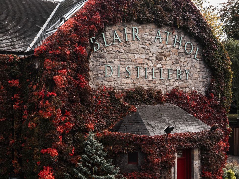 The exterior of Blair Athol distillery covered in ivy at Heilan Roo Killiecrankie near Pitlochry and Blair Atholl