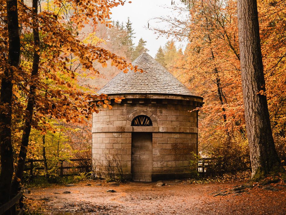 A stone building in a woodland area at Heilan Roo in Killiecrankie near Pitlochry and Blair Atholl