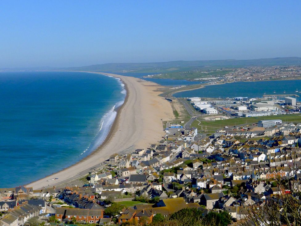 An aerial view of a beach and houses at Seasides in Weymouth