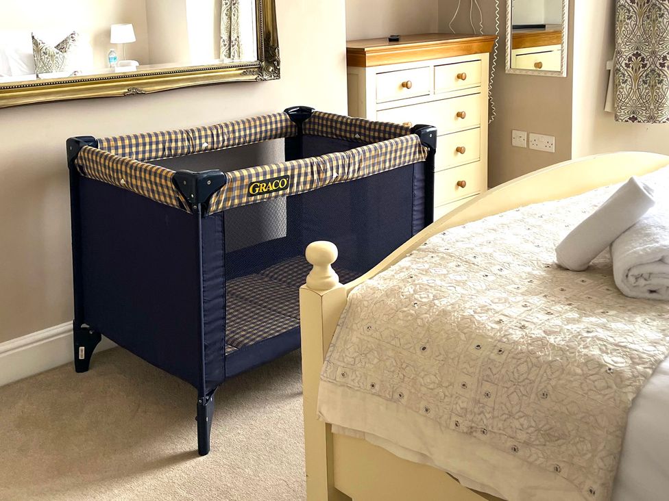 A crib in a bedroom at Seasides in Weymouth